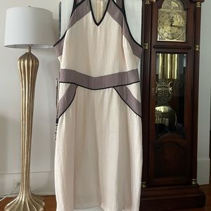 Modern block neutral colored adjustable strap, apron collar with cutouts dress